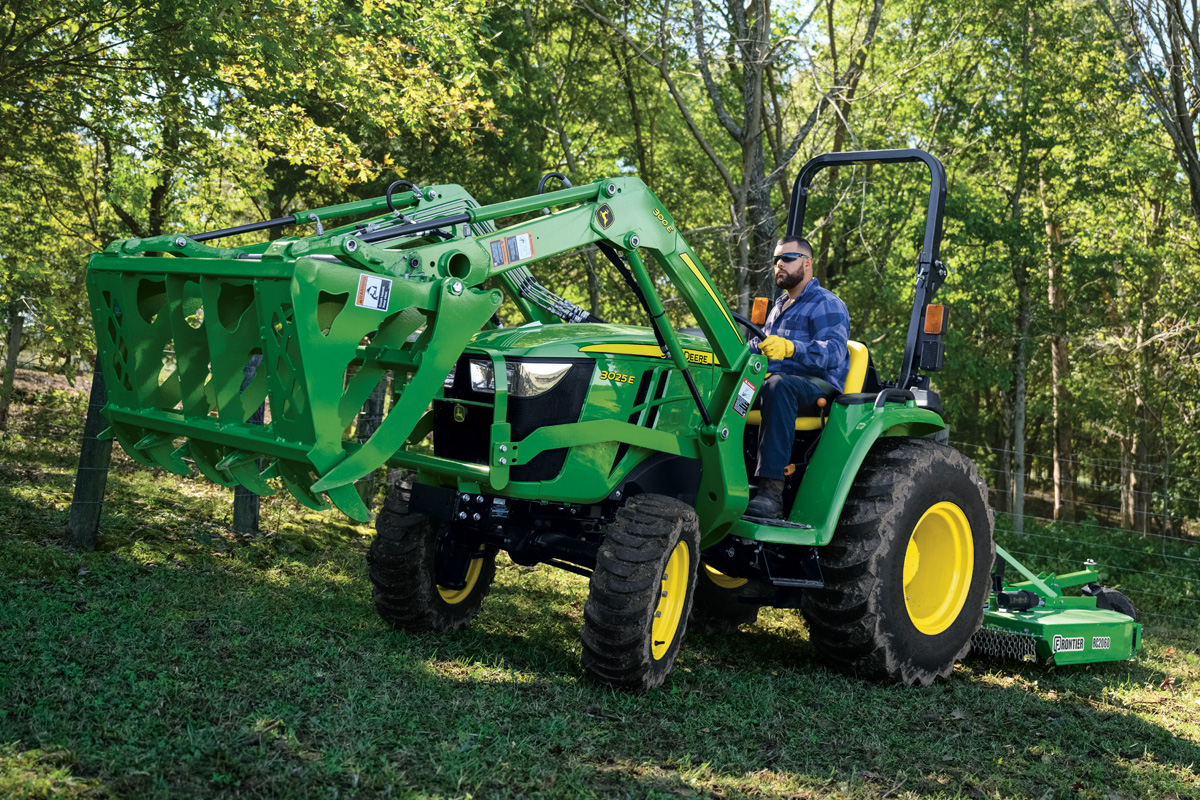 John Deere compact tractor working outdoors
